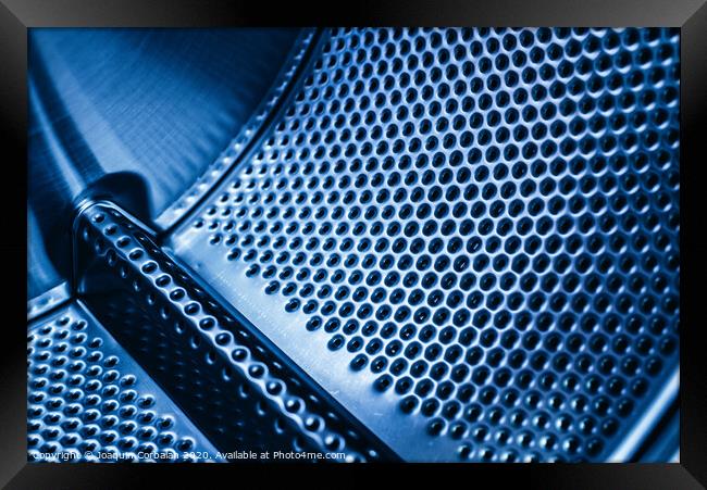 Detail of the drum of a washing machine, steel industrial texture with holes. Framed Print by Joaquin Corbalan