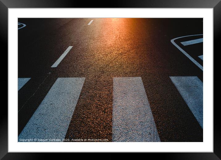 Lonely street with pedestrian crossing at sunset, texture with space for text. Framed Mounted Print by Joaquin Corbalan