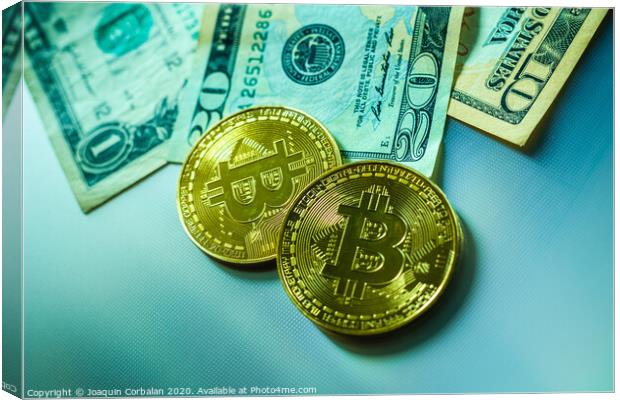 Bright bitcoin coins next to dollar bills. Canvas Print by Joaquin Corbalan