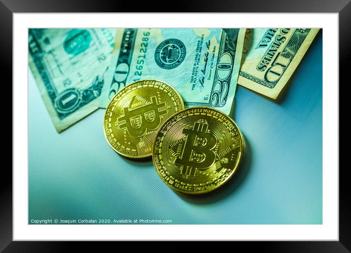 Bright bitcoin coins next to dollar bills. Framed Mounted Print by Joaquin Corbalan