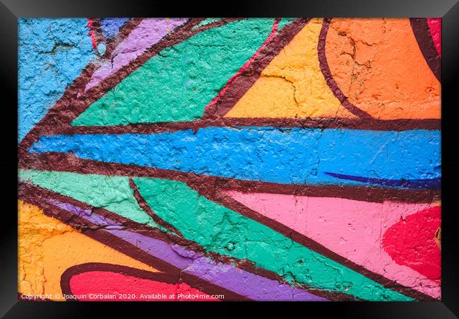 Detail of an anonymous street graffiti with many colors, cheerful urban background. Framed Print by Joaquin Corbalan