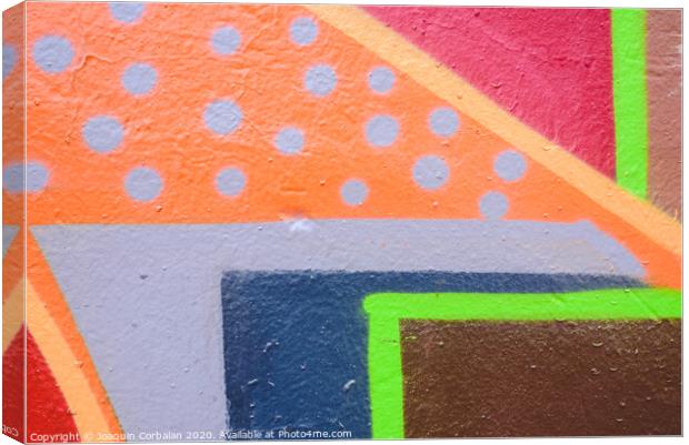 Detail of an anonymous street graffiti with many colors, cheerful urban background. Canvas Print by Joaquin Corbalan