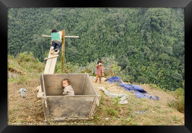 Children from villages in the mountainous area of ​​Sapa, north of Vietnam, expecting to see Western tourists. Framed Print by Joaquin Corbalan