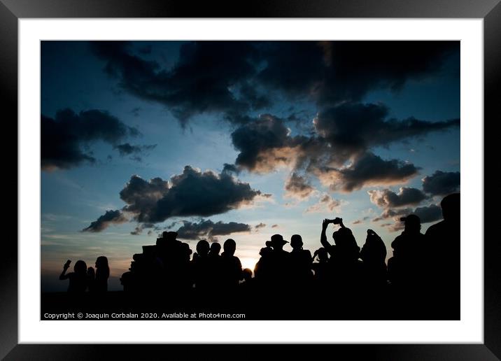 Group of people at sunrise photographing the sun, silhouettes of people Framed Mounted Print by Joaquin Corbalan