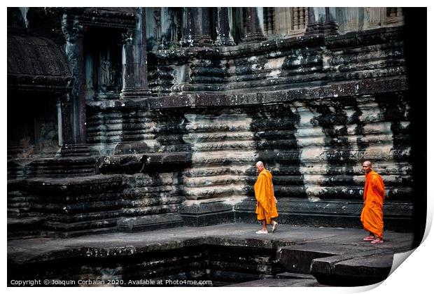 tibetan monks in orange robes visiting remote Cambodian temples to meditate. Print by Joaquin Corbalan