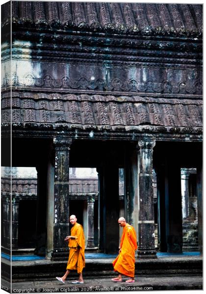 Buddhist monks meditating while walking through the Angkor Thom temple Canvas Print by Joaquin Corbalan