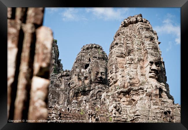 Ruins of ancient temples around the religious complex of Angkor Thom Framed Print by Joaquin Corbalan