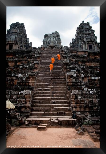 Buddhist monks meditating while walking through the Angkor Thom temple Framed Print by Joaquin Corbalan