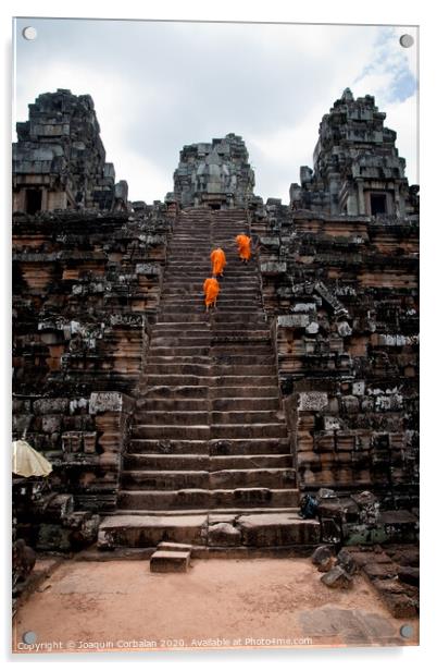 Buddhist monks meditating while walking through the Angkor Thom temple Acrylic by Joaquin Corbalan