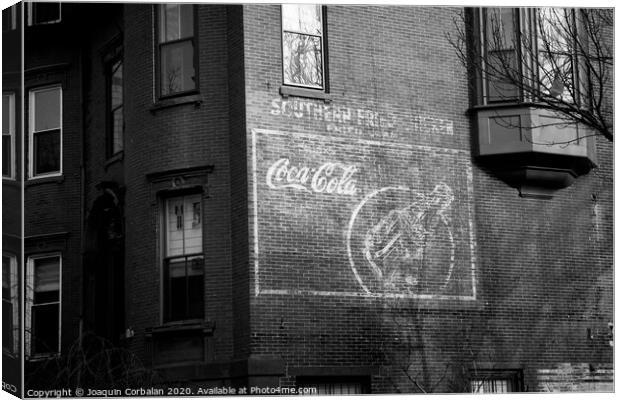 Old advertising poster of soda drink on the brick walls of a building. Canvas Print by Joaquin Corbalan