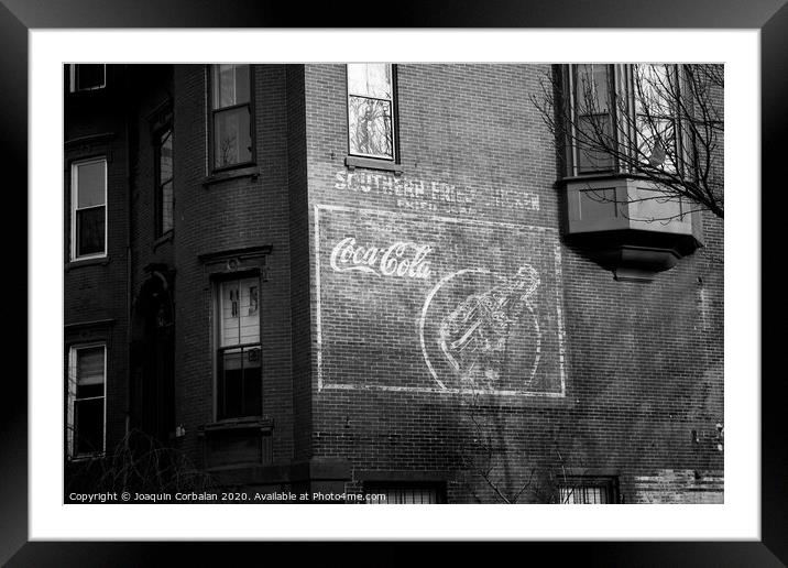 Old advertising poster of soda drink on the brick walls of a building. Framed Mounted Print by Joaquin Corbalan