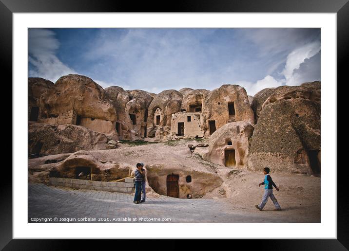 Caves excavated in the rock as dwellings in the city of Cavusin, in the region of Turkish Cappadocia. Framed Mounted Print by Joaquin Corbalan