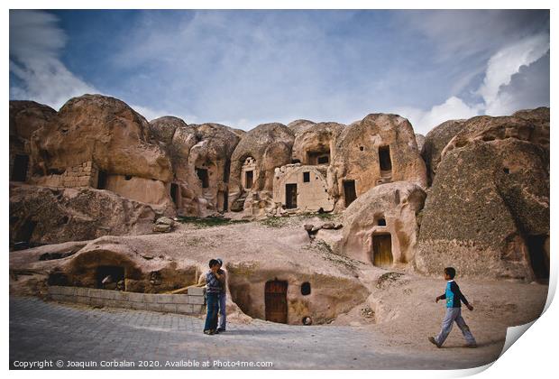 Caves excavated in the rock as dwellings in the city of Cavusin, in the region of Turkish Cappadocia. Print by Joaquin Corbalan