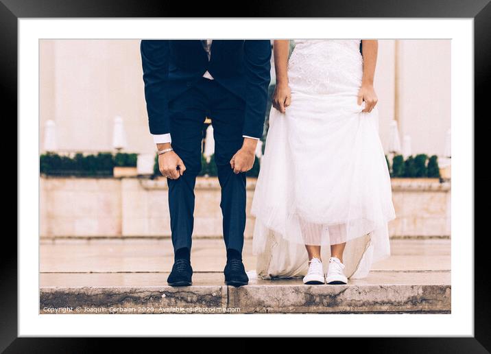 Just married couple in the Eiffel tower on wedding day. Walking an kissing in Paris Framed Mounted Print by Joaquin Corbalan