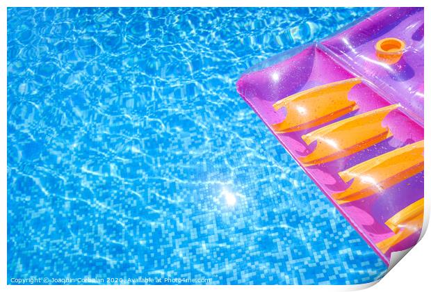 Transparent water from a pool, background with summer colored floats. Print by Joaquin Corbalan