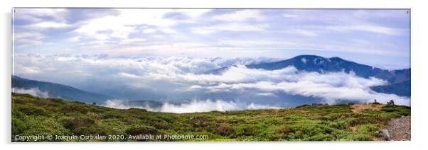 Panoramic image of the views of the Sierra de Guadarrama with its clouds from the top of a mountain peak. Acrylic by Joaquin Corbalan