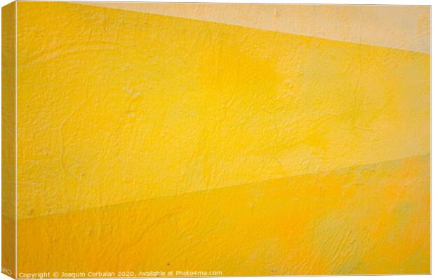 A wall painted with lines of various colors, yellow and orange tones. Canvas Print by Joaquin Corbalan