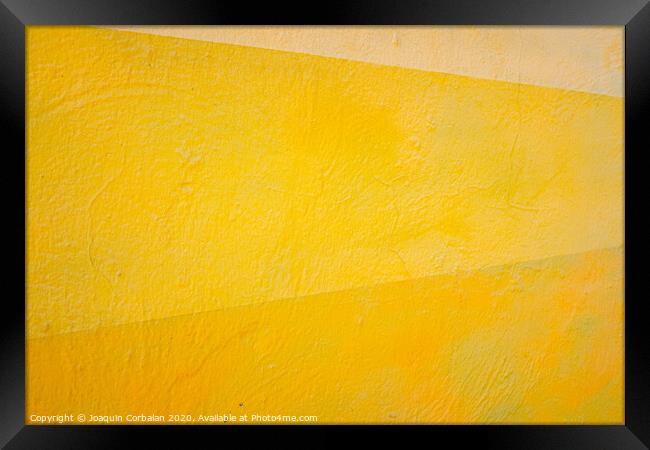 A wall painted with lines of various colors, yellow and orange tones. Framed Print by Joaquin Corbalan