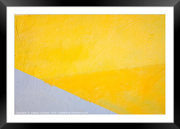 A wall painted with lines of various colors, yellow and orange tones. Framed Mounted Print by Joaquin Corbalan