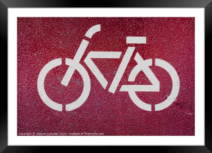 Symbol of a bicycle indicating a bike lane to pedal safely. Framed Mounted Print by Joaquin Corbalan