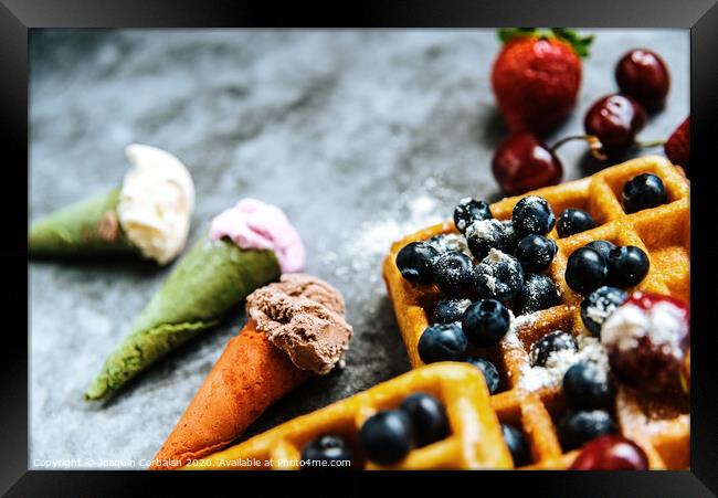 Ice creams and waffles with tasty red fruits full of healthy vitamins, over dark stone background with copy space for text. Framed Print by Joaquin Corbalan