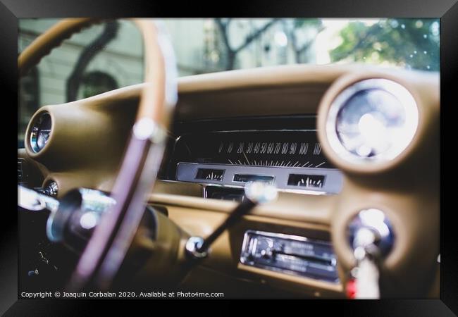 Valencia, Spain - July 21, 2012: Dashboard and steering wheel of a luxury vintage car, an American Mustang. Framed Print by Joaquin Corbalan