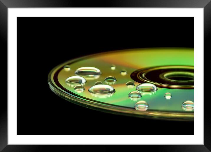 CD with water droplets Framed Mounted Print by Beata Aldridge