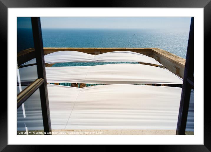 Serene sea seen from the window of a summer residence in the Mediterranean. Framed Mounted Print by Joaquin Corbalan