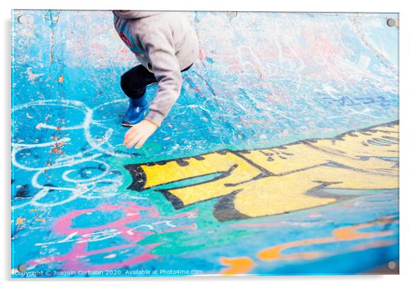 Boy running inside an urban skatepark with sweatshirt having fun, blue tones. Acrylic by Joaquin Corbalan