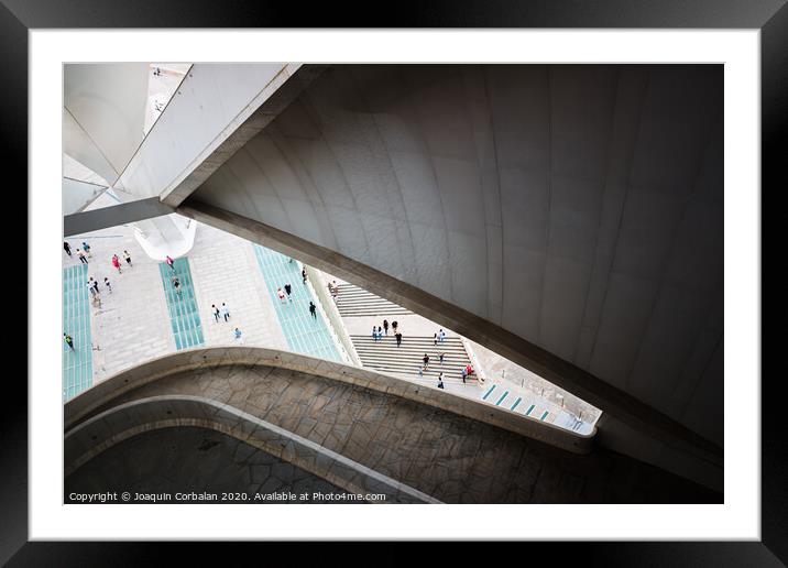 Tourists walk the gardens around the Opera building, seen from inside. Framed Mounted Print by Joaquin Corbalan