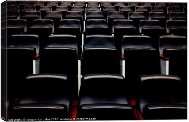 Rows of empty seats and seats in an auditorium. Canvas Print by Joaquin Corbalan