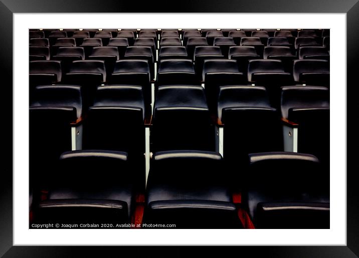 Rows of empty seats and seats in an auditorium. Framed Mounted Print by Joaquin Corbalan