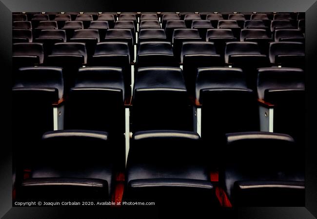 Rows of empty seats and seats in an auditorium. Framed Print by Joaquin Corbalan