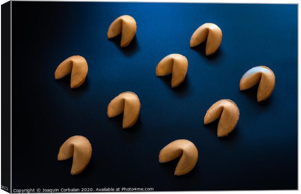 Fortune cookies on dark background arranged symmetrically Canvas Print by Joaquin Corbalan