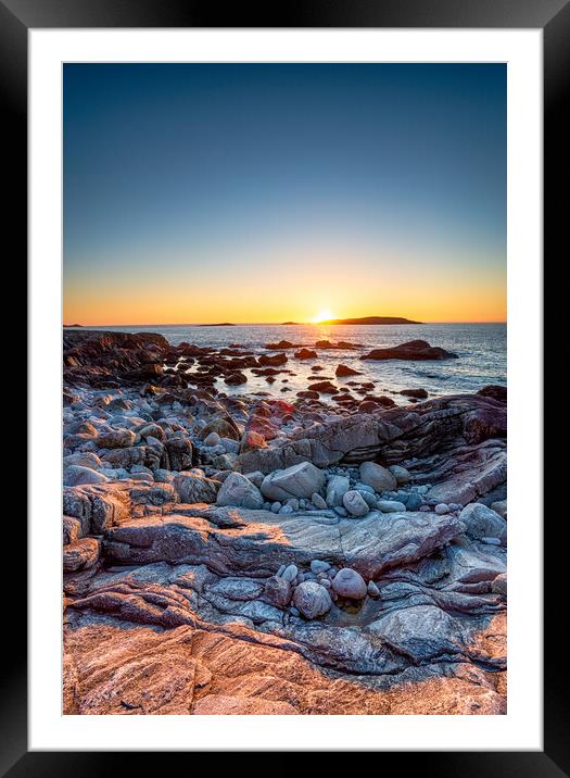 Sunset over the rocky beach at Mealista  Framed Mounted Print by Helen Hotson