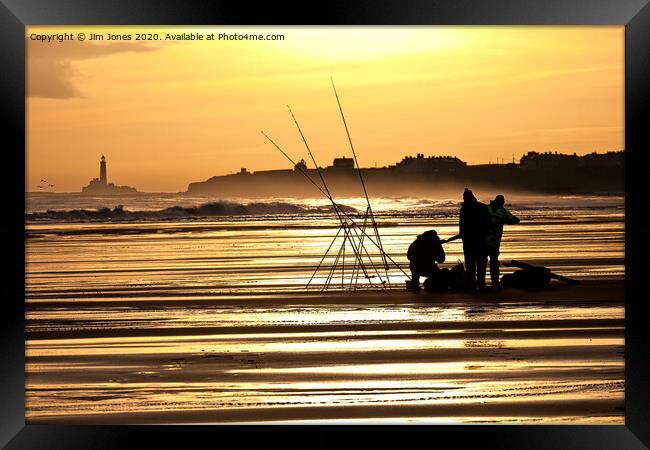 Fishermen on the beach at sunrise Framed Print by Jim Jones