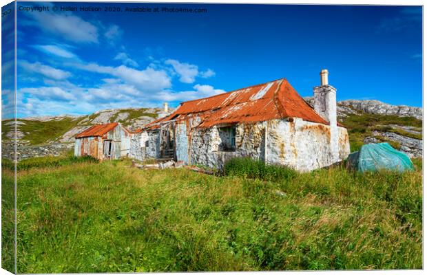 An old ruined croft with a rusty red tin roof at Quidnish Canvas Print by Helen Hotson