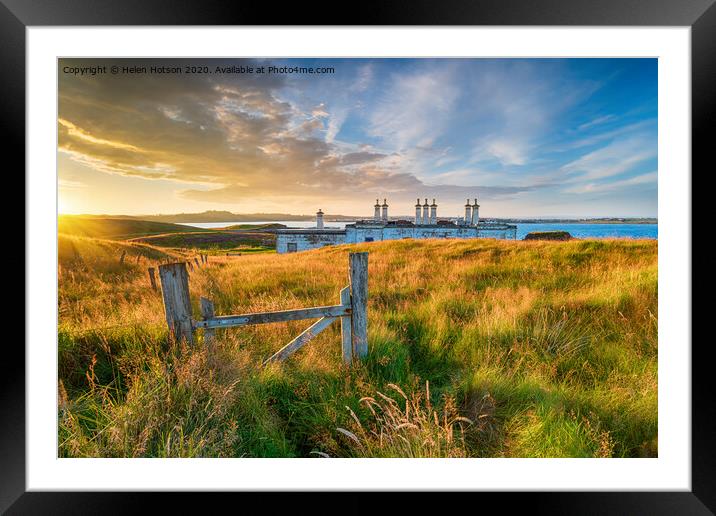 Sunset over the old coastguard cottages at Arnish Point Framed Mounted Print by Helen Hotson