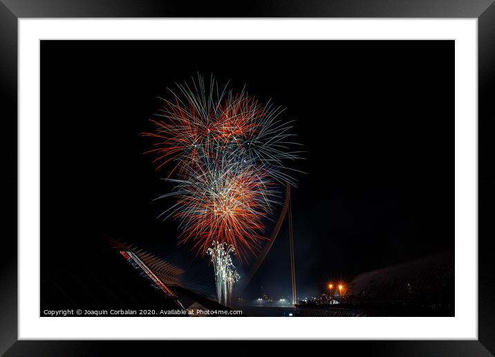 Colorful fireworks over the night city, free black space for text. Framed Mounted Print by Joaquin Corbalan