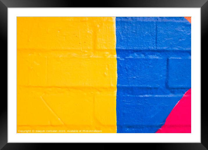 Colorful pattern painted on a wall. Framed Mounted Print by Joaquin Corbalan