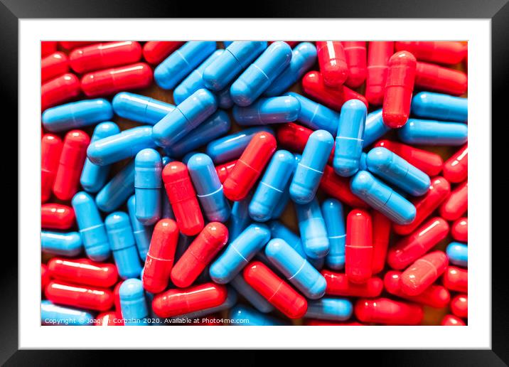 Choosing between two options is difficult, many red and blue pills mixed to choose which one to take. Framed Mounted Print by Joaquin Corbalan