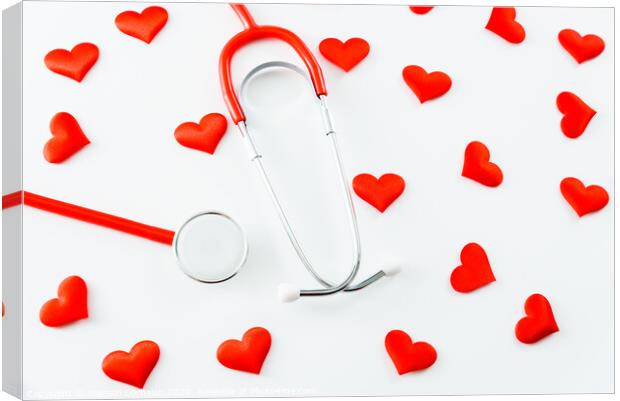 Stethoscope isolated on white background with red hearts. Canvas Print by Joaquin Corbalan