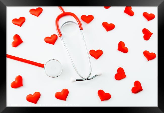 Stethoscope isolated on white background with red hearts. Framed Print by Joaquin Corbalan