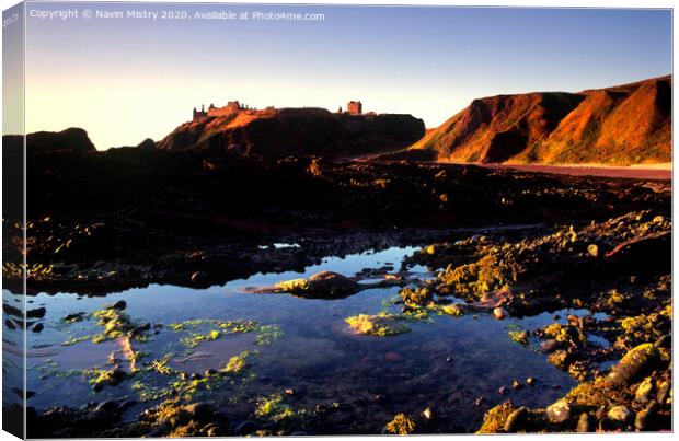 Dunnottar  Castle near Stonehaven seen from the rocky beach below Canvas Print by Navin Mistry