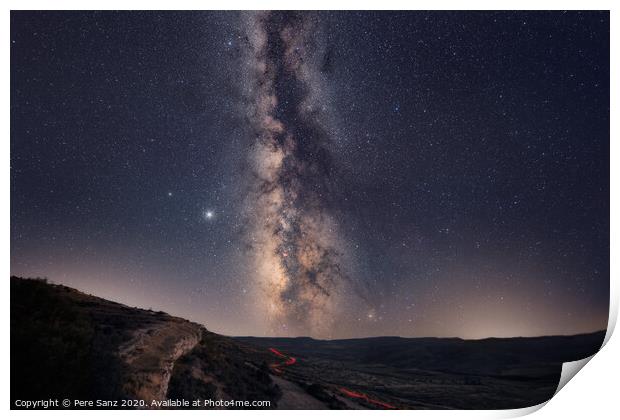 The Milky Way with car light trails on the Foreground Landscape Print by Pere Sanz