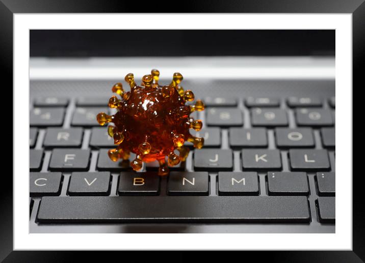 coronavirus covid-19 on a keyboard of a notebook p Framed Mounted Print by Alessandro Della Torre