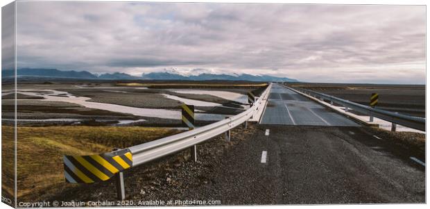 Icelandic lonely road in wild territory with no one in sight Canvas Print by Joaquin Corbalan