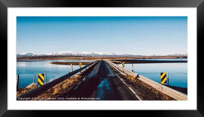 Icelandic lonely road in wild territory with no one in sight Framed Mounted Print by Joaquin Corbalan