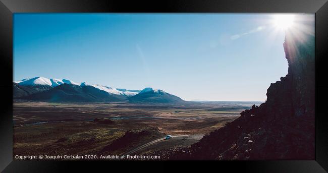 Icelandic landscapes full of green grass, sea and blue sky. Framed Print by Joaquin Corbalan