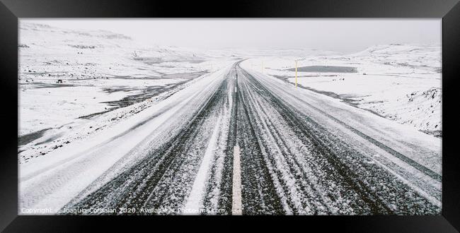 Road trip secondary with snow without anyone driving through Iceland Framed Print by Joaquin Corbalan